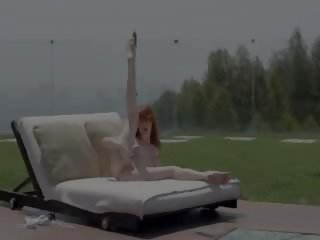 Perky redhead opening puss out doors