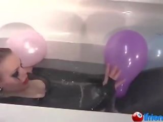 Latek dressed mademoiselle with balloons in a bathtub