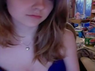 Seductress Squeezing Her Tits