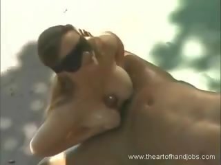 Busty grand stunner enjoyed an outdoor handjob