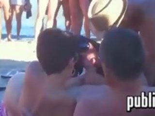 Swingers having fun at a pantai for a crowd