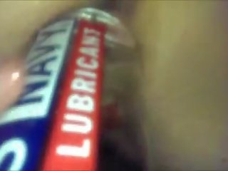 Fucking her muff with a bottle