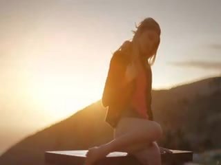 Dressed blonde initiate an orgasm at sunrise