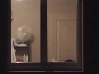 My bewitching neighbour showing susu - window voyeur