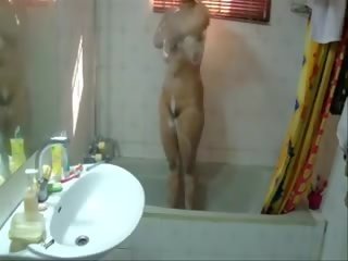 A pleasant Big Boobed Slim teenager Is Taking A Bath In