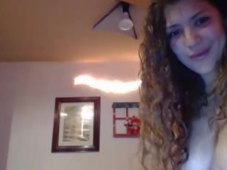 Curly hair young lady fucks her burungpun up close with dildo