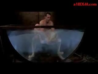 Blonde sweetheart With Tied Legs And Arms Getting Her Mouth And Pussy Fucked In The Aquarium By specialist In The Dungeon