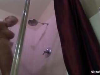 Nikita shaves her pussy in the shower