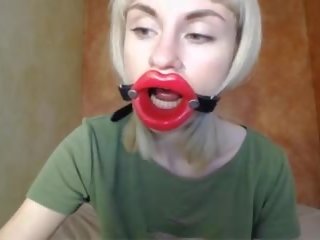 Zooming in Red Lips produce Mouth Gag for Dildo-blowjob.