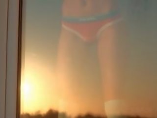 Sasha in little pink kathok flashing small susu by the