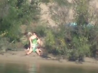 Shy and lustful teenager rides pecker on the river
