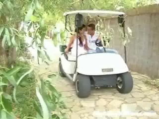 A adolescent and her sweetheart are driving around in a golf cart. suddenly they stop and the oglan introduces to touch the gyz up,