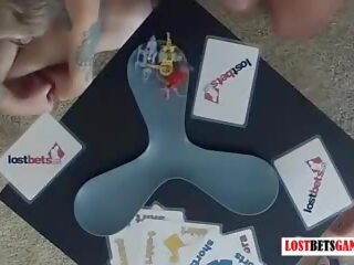 One bloke and two girls play strip robot battle game: x rated film 97